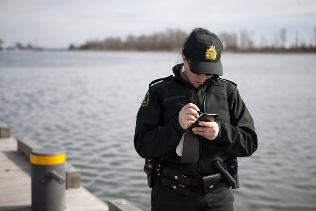 Documenting the compliance check in my field notebook. Photo by Trevor Meier