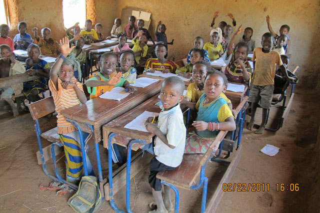 Koura primary school children disrupted by photographer John Telgmann. Ten years ago there was no school in Koura - now there is only a primary school.

