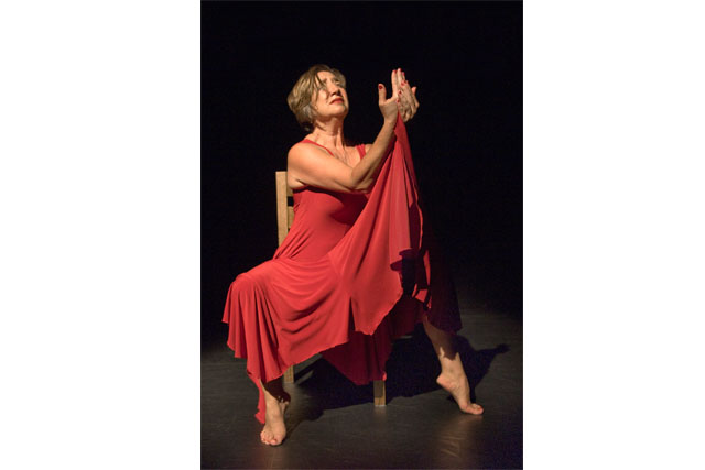 Celeste Snowber performing Woman Giving Birth to a Red Pepper at The Cultch Theatre in Vancouver, September 2013. Photo by Chris Randle.