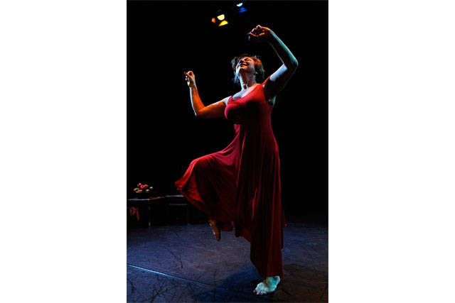 Celeste Snowber performing Woman Giving Birth to a Red Pepper at The Cultch Theatre in Vancouver, September 2013. Photo by Chris Randle.